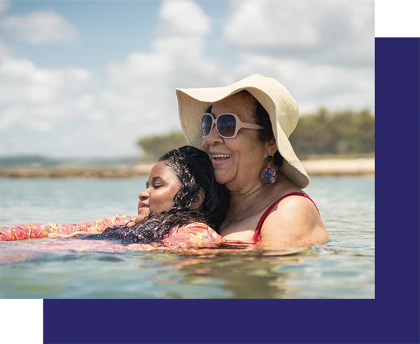 Grandma and granddaughter in swimming pool